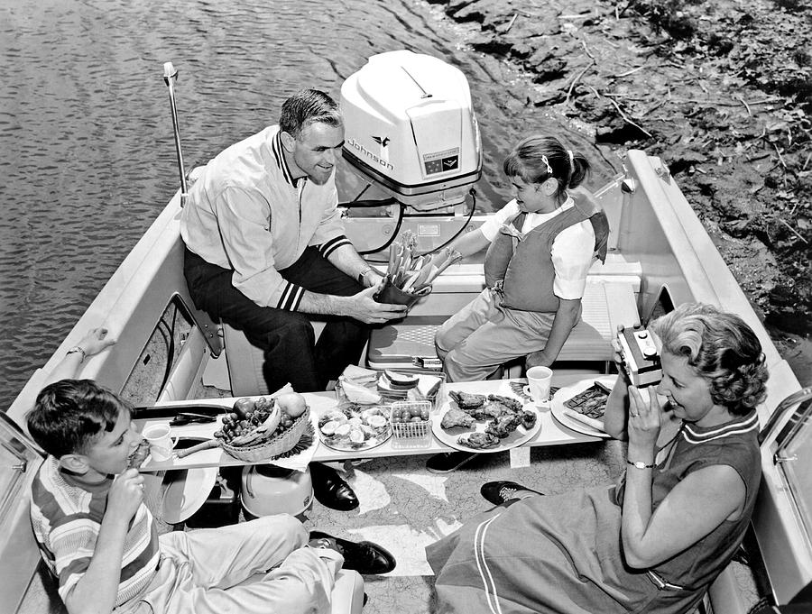 Black And White Photograph - Family Boating Lunch by Underwood Archives