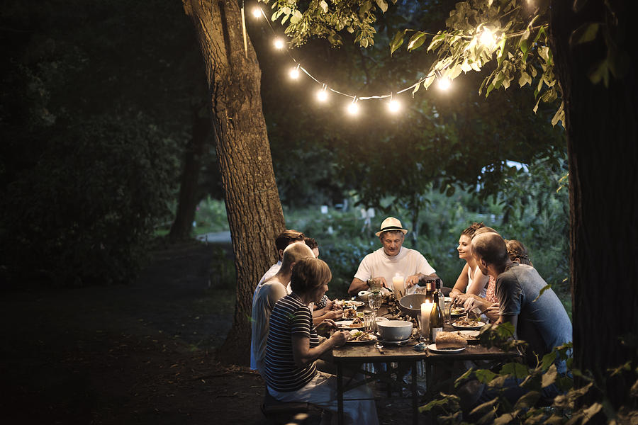 Family Dinner At The Garden Photograph by Hinterhaus Productions