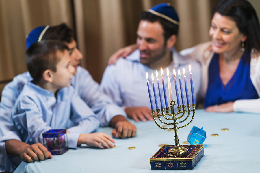 Family of four celebrating hanukkah Photograph by Kali9