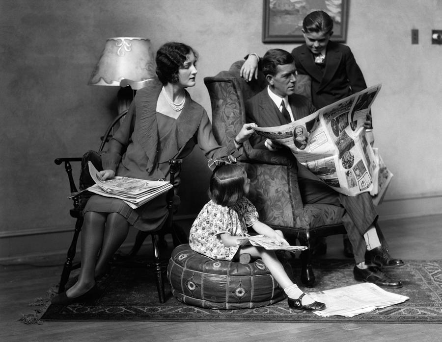 Family Reading The Paper, C.1920s Photograph by H. Armstrong Roberts/ClassicStock