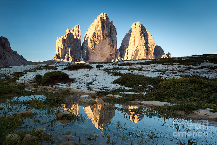 Famous three peaks at sunrise Dolomites Italy Photograph by Matteo Colombo
