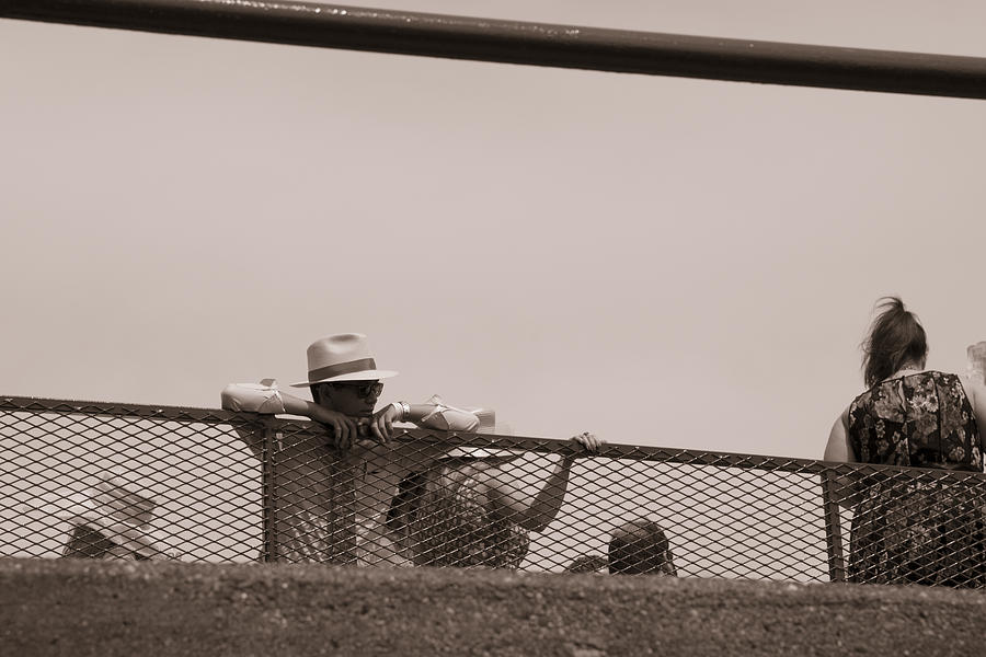 Black And White Photograph - Fan watching the horses at Churchill Downs  by John McGraw