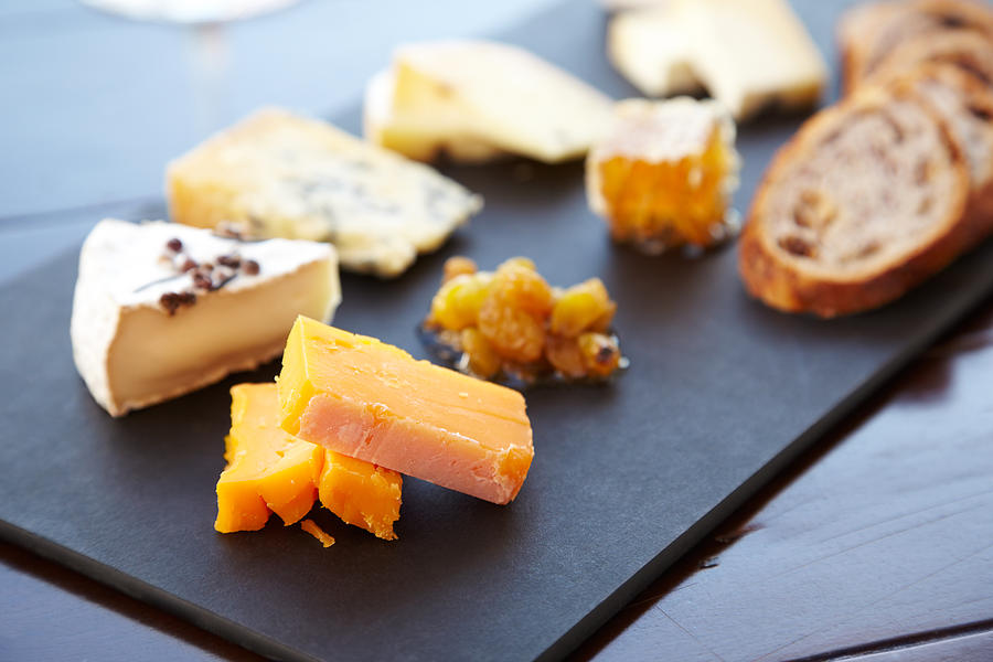 Fancy cheese plate with bread and honey Photograph by GSPictures