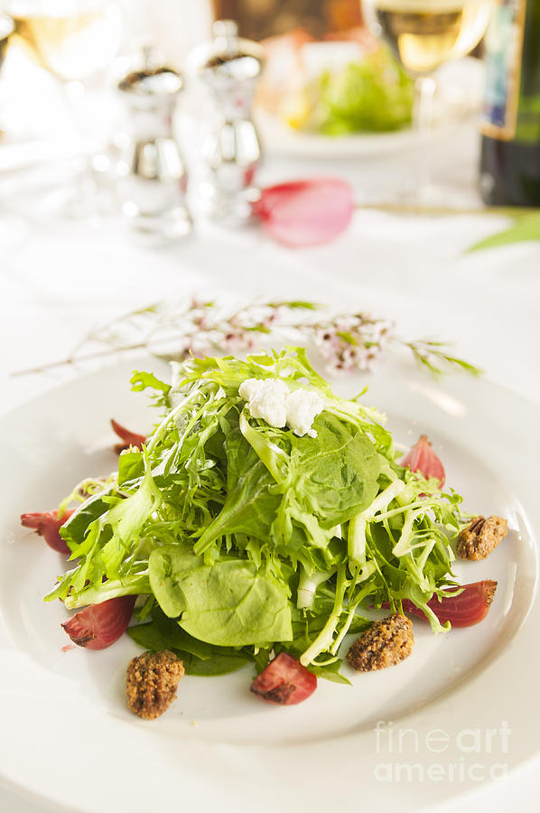 Fancy healthy salad on a white plate. Photograph by Don Landwehrle