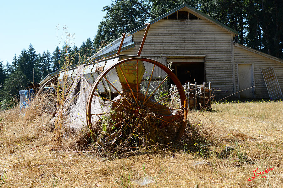 Farm Equipment and Barn Photograph by Charles Fennen