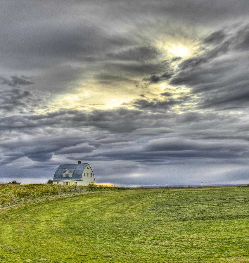 Farm House and Storm Clouds Photograph by Claudio Bacinello