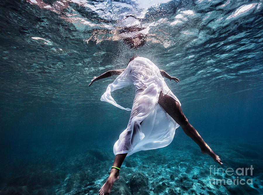 Fashionable model dancing underwater Photograph by Anna Om