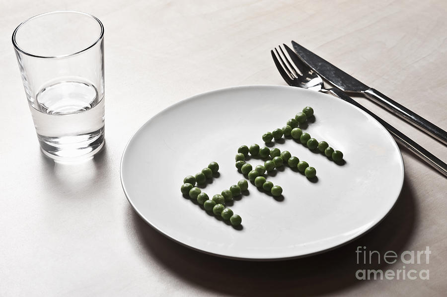 FAT spelt out with peas Photograph by Doron Magali
