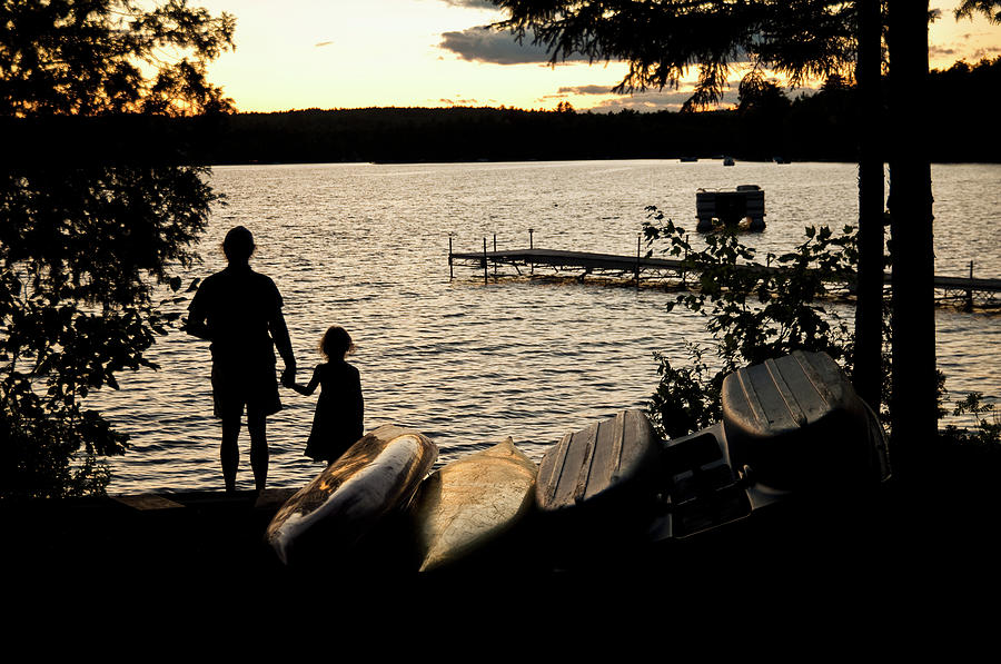 Father And Daughter Watch A Sunset On Photograph by Brian Guzzetti / Design Pics