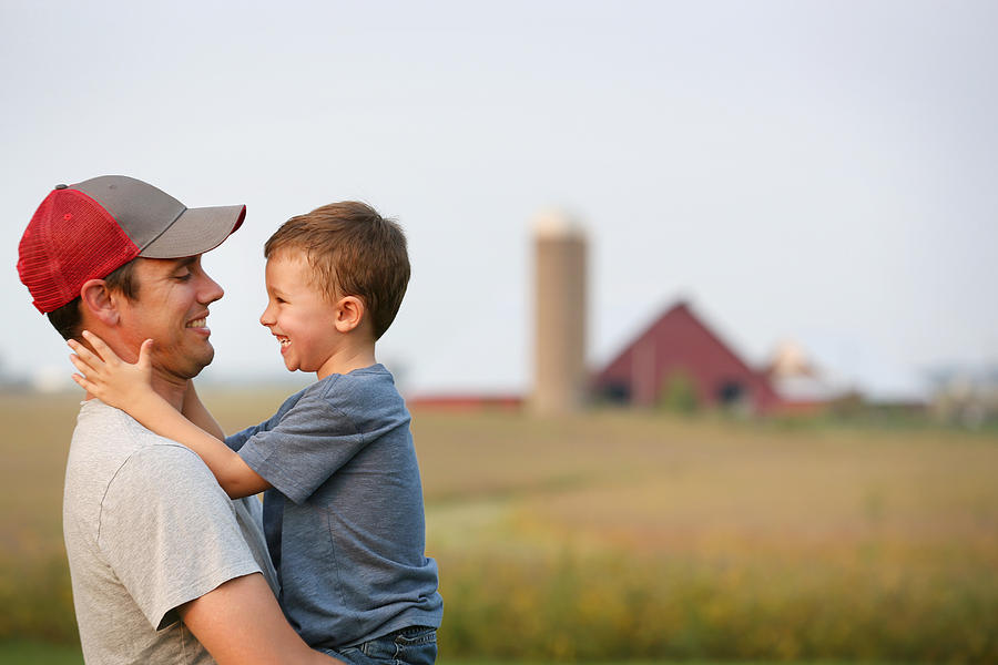 Father and son on their family farm Photograph by Katrina Wittkamp