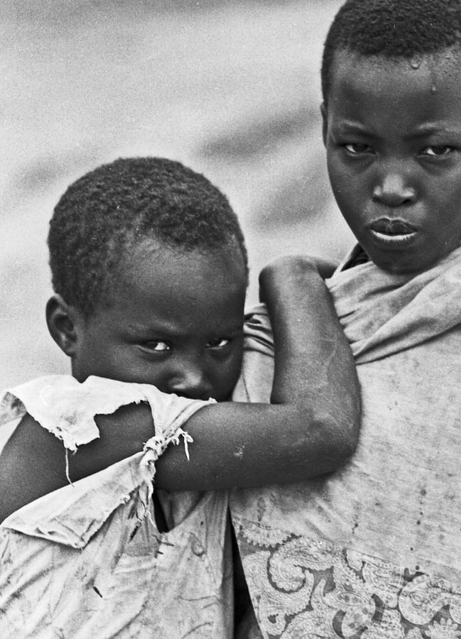 Fearful Rwandan refugee child finds refuge in older sister Photograph ...