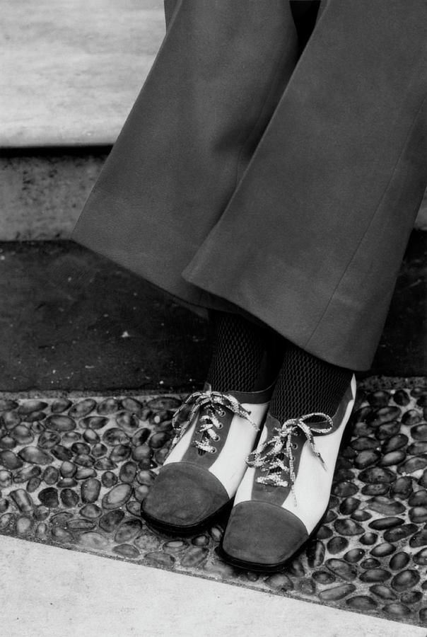 Feet Of A Model Wearing Two-tone Pant Shoes by William Connors