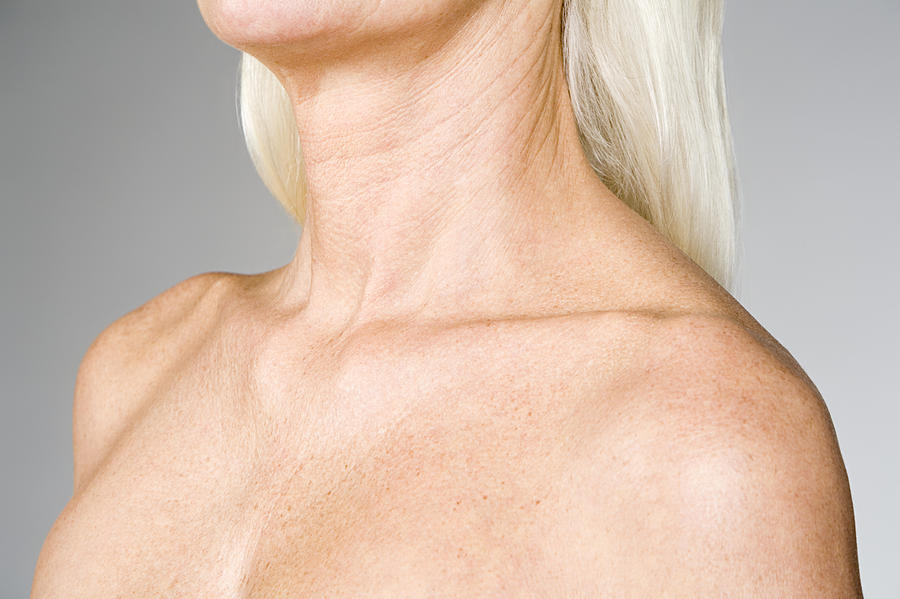 Female chest and shoulders Photograph by Image Source