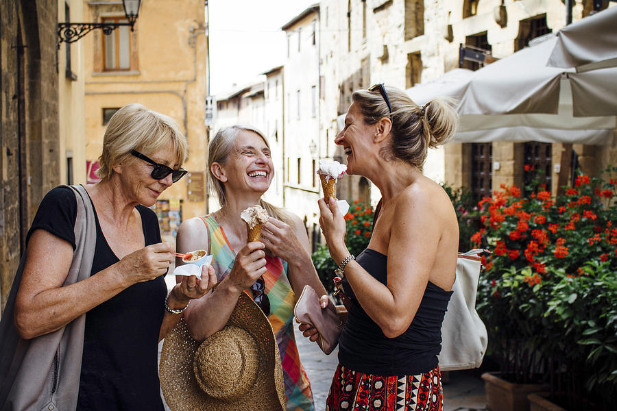 Female Friends Enjoying Italian Ice-Cream Photograph by SolStock