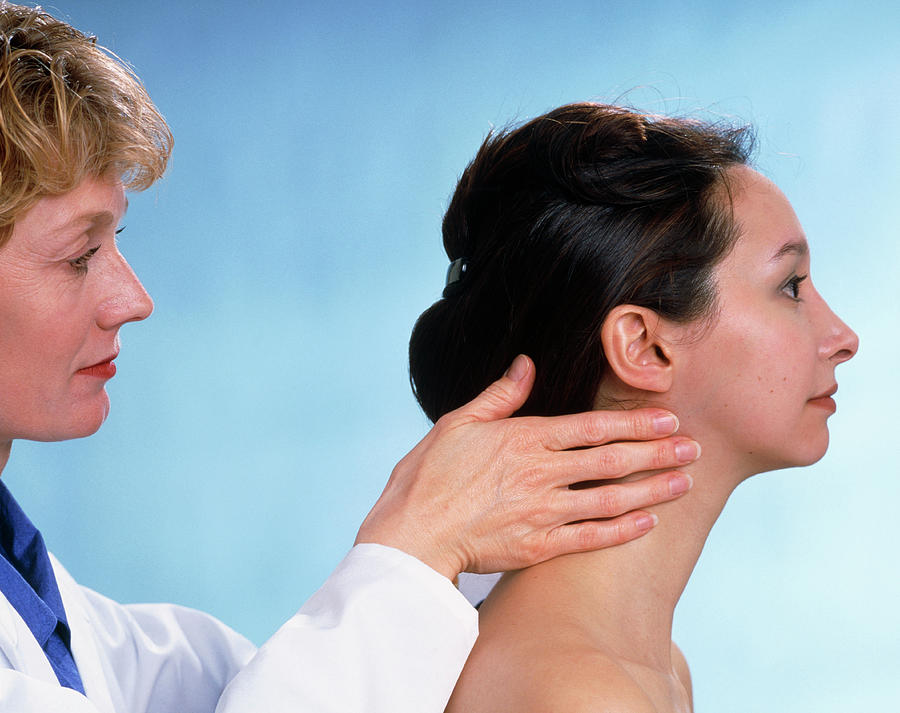 Female Gp Palpating The Lymph Glands Of A Woman Photograph by Saturn ...