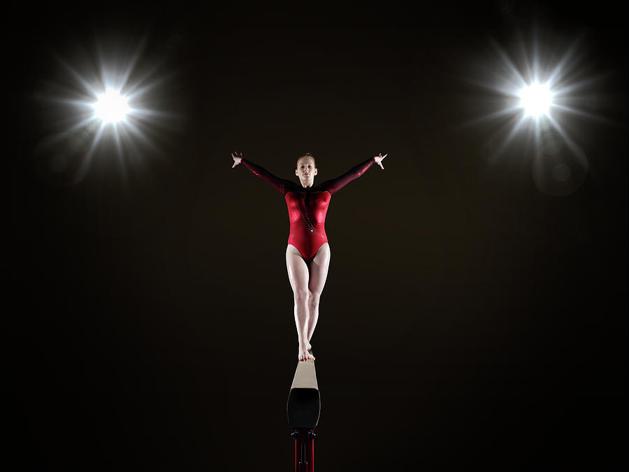 Female Gymnast On Balance Beam Photograph by Mike Harrington