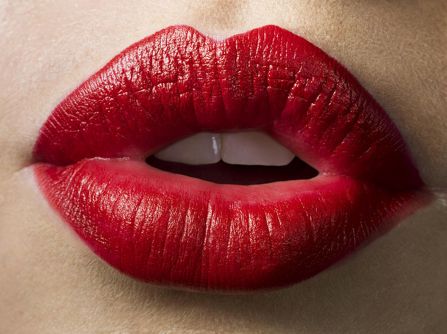 Female lips with red lipstick on, close up Photograph by Jonathan Knowles