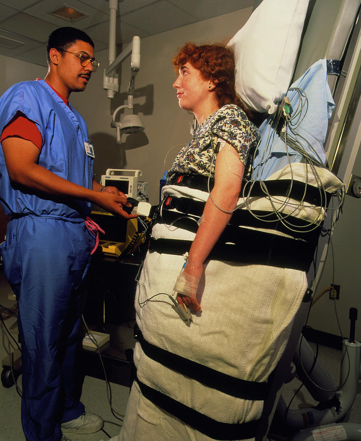 Female Patient On A Tilt Table Used To Diagnose Me Photograph by David Parker/science Photo Library