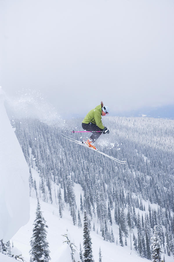 Female Skier Jumping Off Cornice Photograph By Woods Wheatcroft