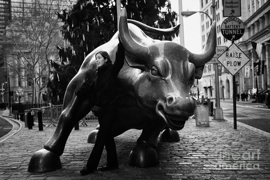 Usa Photograph - female tourist at Charging Bull statue bronze sculpture bowling green park new york city by Joe Fox Usa Photograph - female tourist at Charging Bull statue bronze sculpture bowling green park new york city by Joe Fox