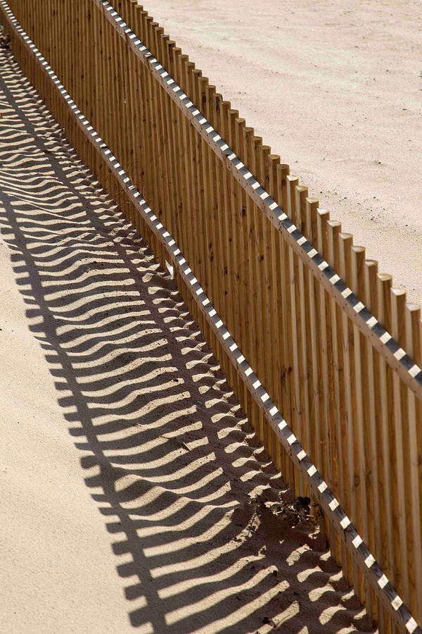 Fence on a Beach in Portugal Photograph by Chris Clark