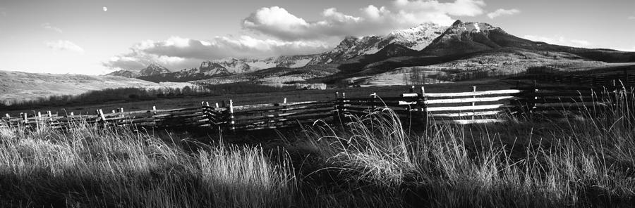Black And White Photograph - Fence With Mountains In The Background by Panoramic Images