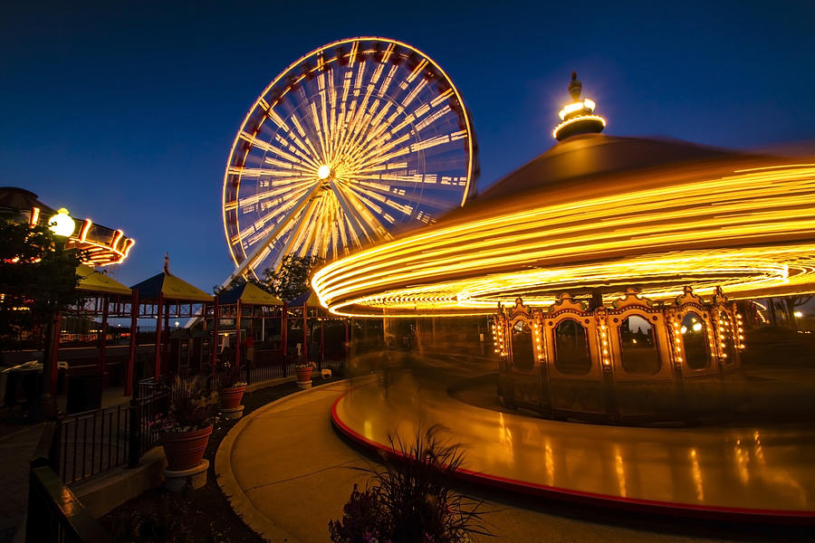Ferris Wheel And Merry Go Round Time Exposure Photograph