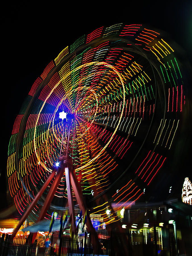 Ferris Wheel In Motion Photograph by Tony Crehan