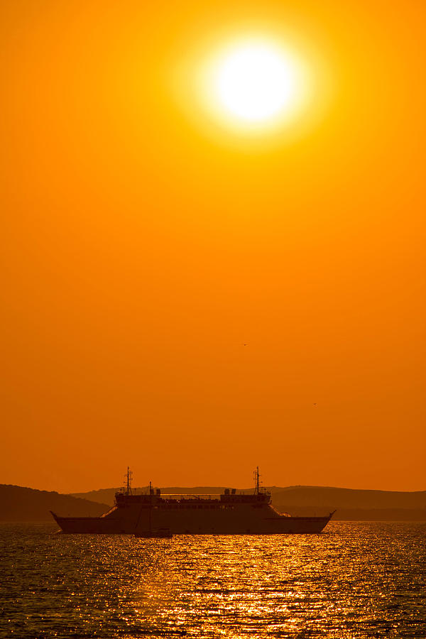 Ferry boat under sun vertical view Photograph by Brch Photography