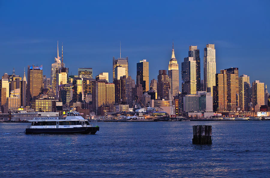 Ferry past Manhattan Photograph by Mitchell R Grosky
