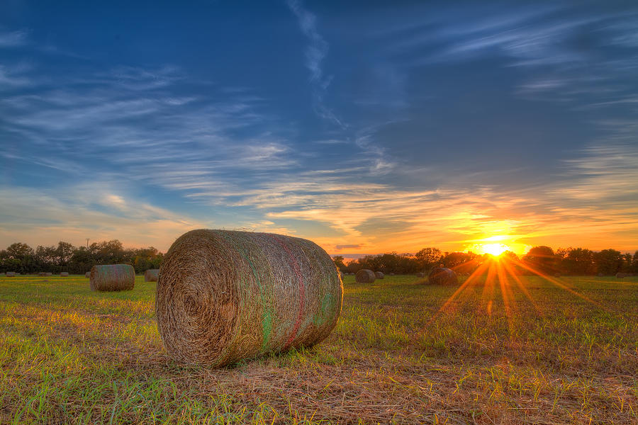 A Hay Bale Sunset Photograph by Tim Stanley