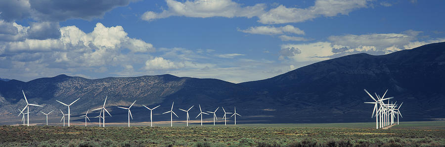 Field Of Wind Generators With Mountains Photograph by Timothy Hearsum