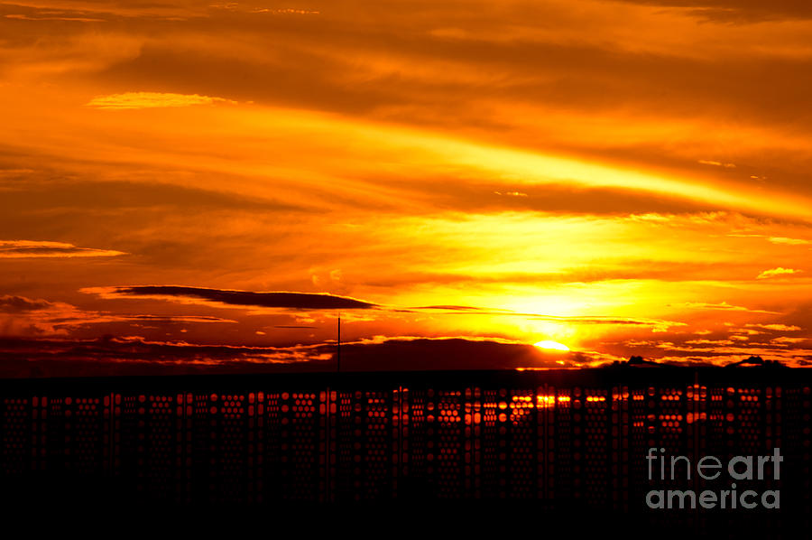 Fiery Sunset Through a Fence Photograph by Beverly Claire Kaiya
