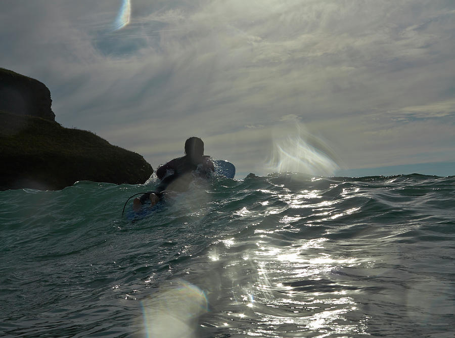 Figure On Surfboard Paddling Out To Sea Photograph by Dougal Waters