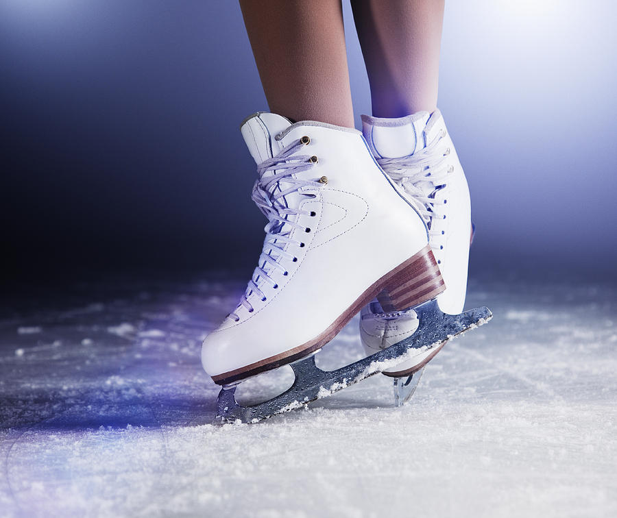 Figure skates on ice Photograph by Robert Decelis Ltd