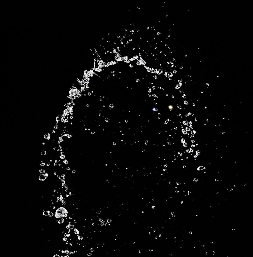 Figures and abstract forms of water on a black background. Photograph by Jose A. Bernat Bacete