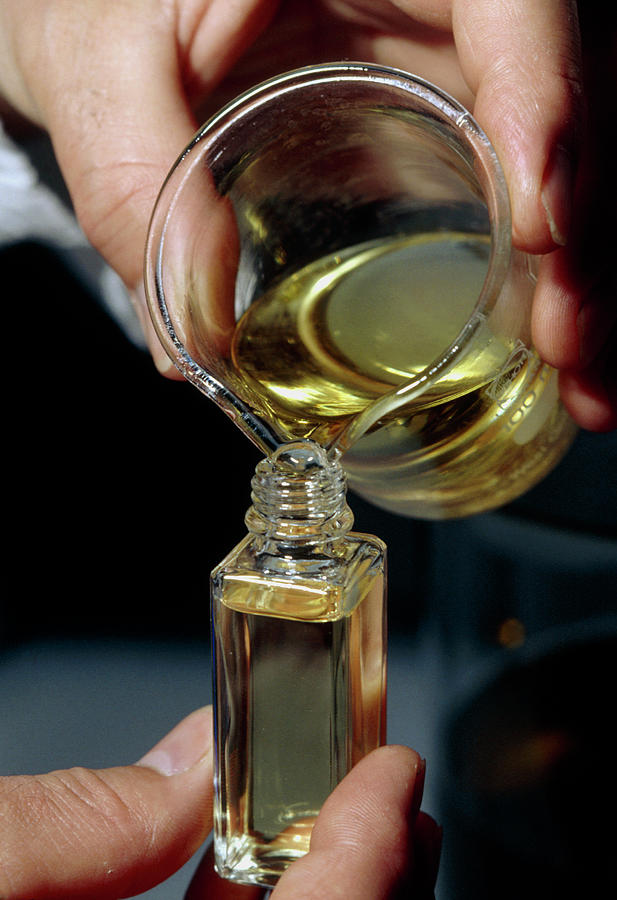 Filling A Sample Bottle With Perfume From A Beaker Photograph by Klaus Guldbrandsen/science Photo Library