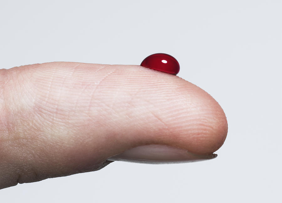 Finger with a bead of blood Photograph by Jonathan Knowles
