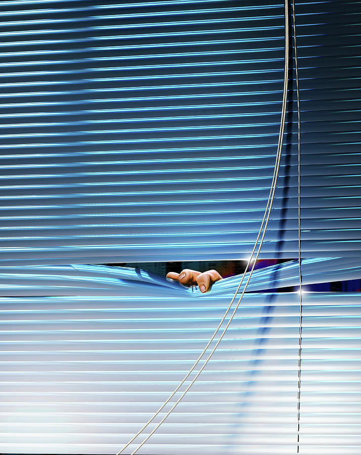 Fingers Peeping Out From Venetian Blinds Photograph by Ikon Ikon Images