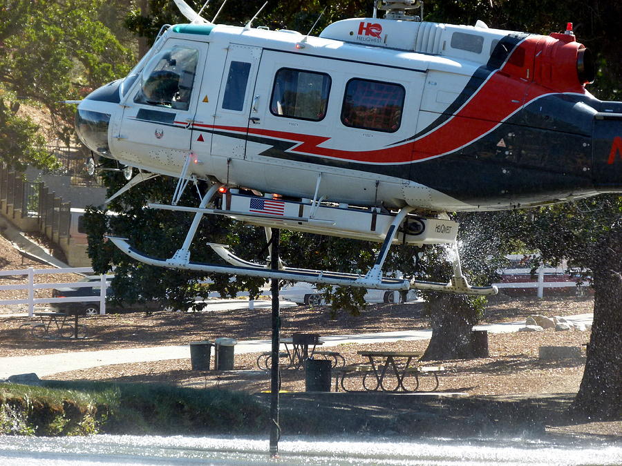 Fire Helicopter Loading Water From Pond Photograph by Jeff Lowe