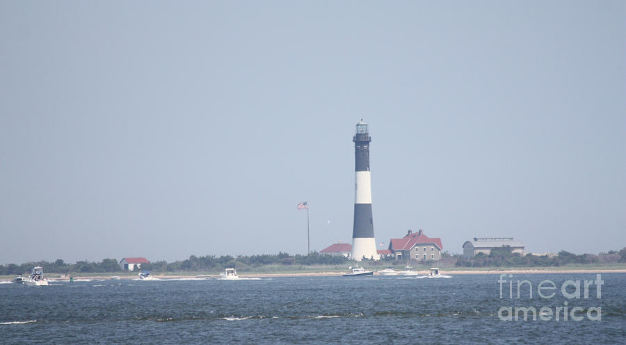Fire Island Lighthouse With Boats Wading In Front Of It #1 of 4 Photograph by John Telfer