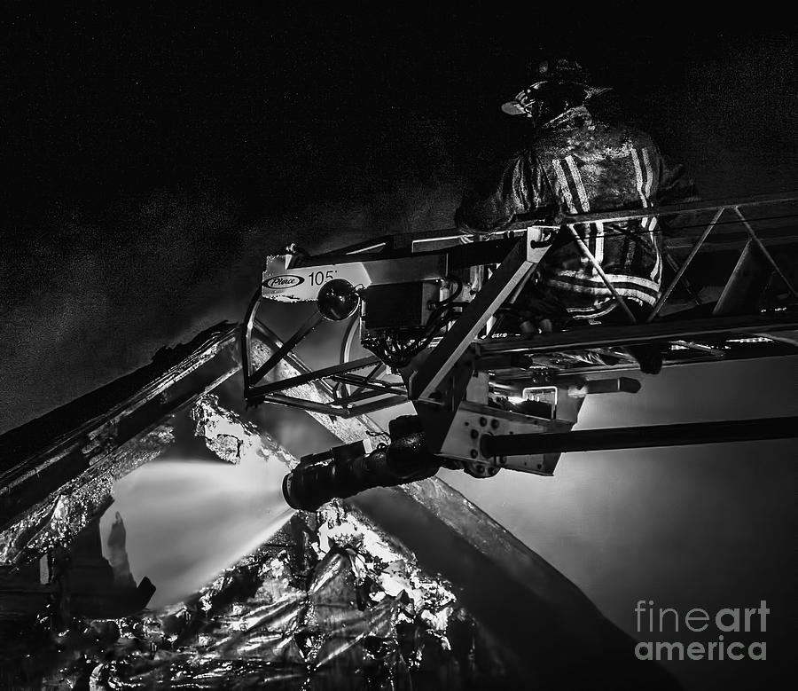Firefighter at work Photograph by Jim Lepard
