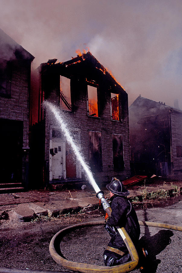 Color Image Photograph - Firefighter During A Rescue Operation by Panoramic Images
