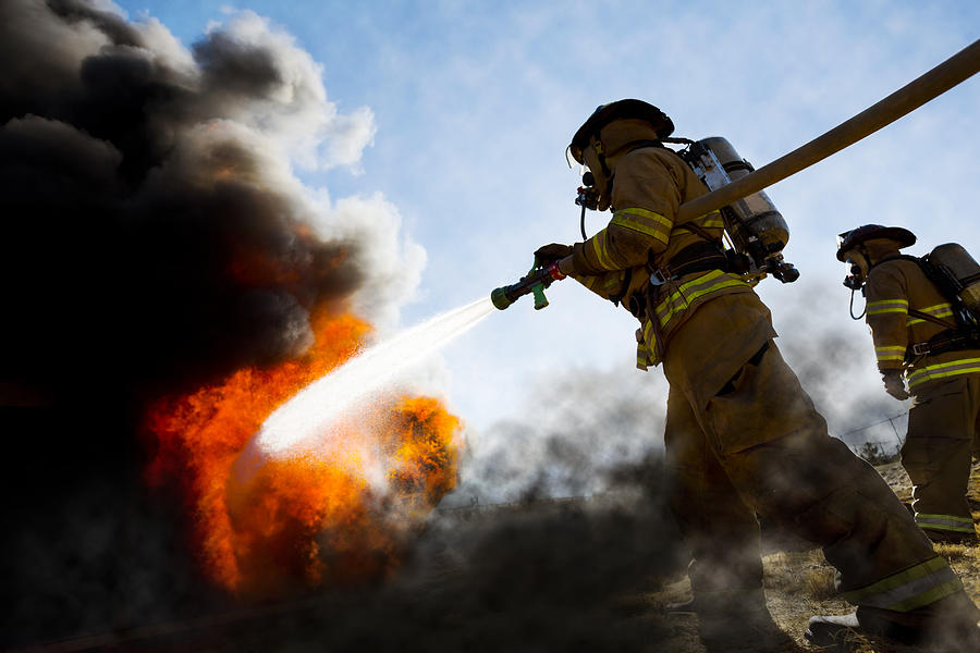 Firefighters Extinguishing House Fire Photograph by Stevecoleimages