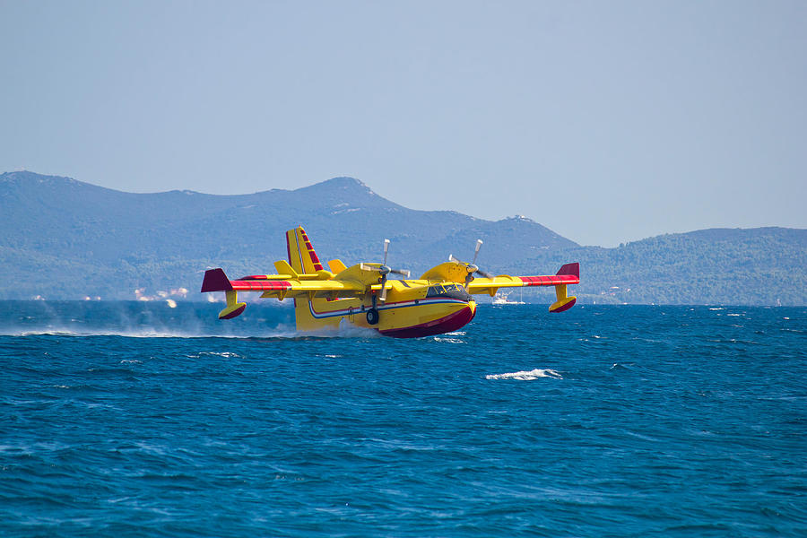 Nature Photograph - Firefighting airplane taking water from sea by Brch Photography