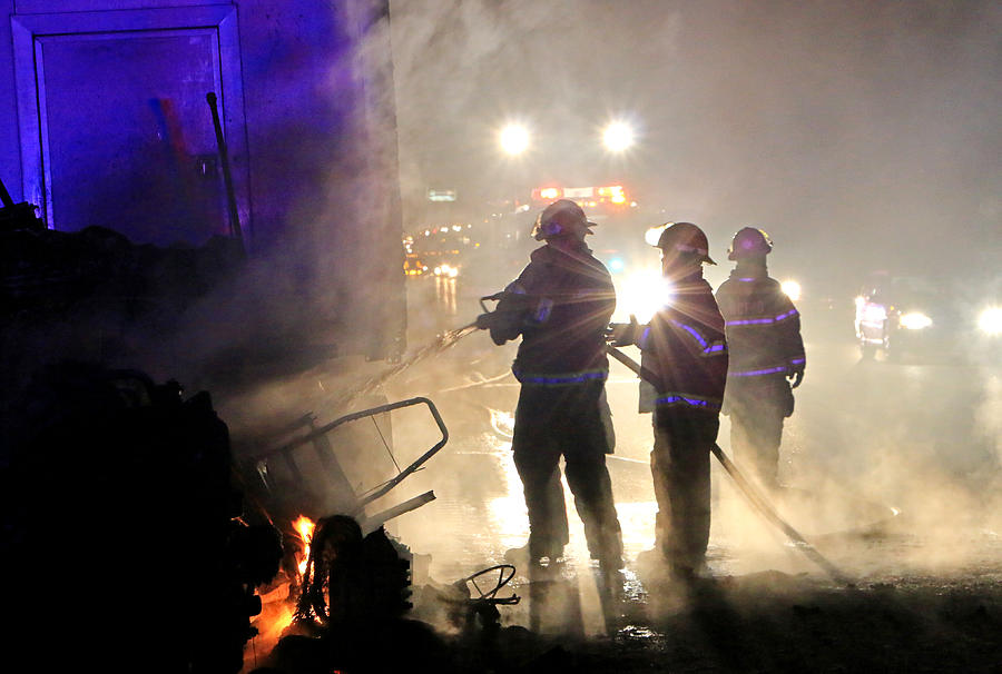 Firefighting Glare Photograph by Christopher McKenzie