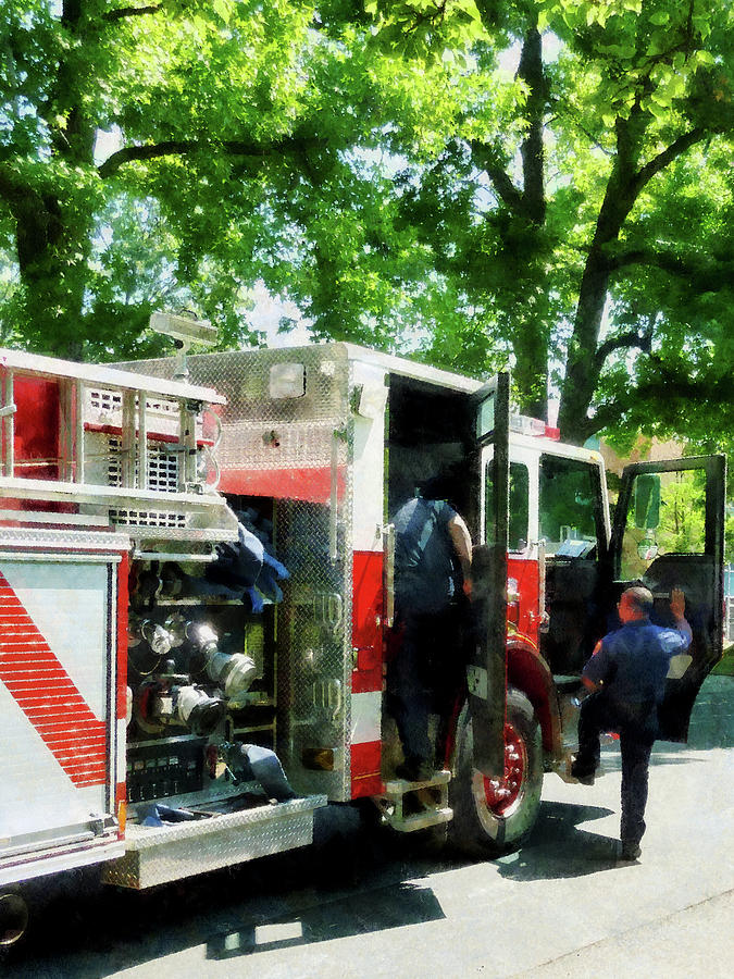 Firefighters Photograph - Fireman - Getting into the Fire Truck by Susan Savad