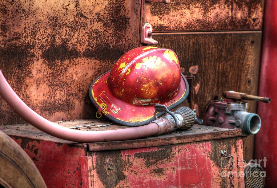 Firemans Helmet and Hose Photograph by Jimmy Ostgard