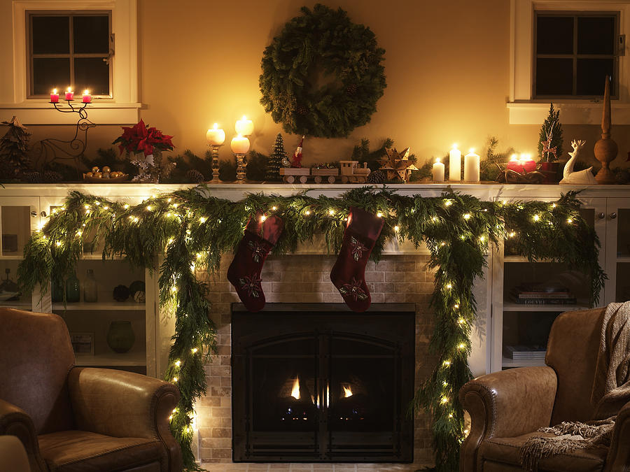 Fireplace with Christmas decoration Photograph by Ryan McVay