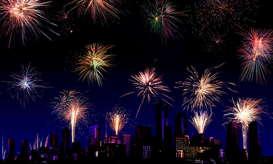 Independence Day Photograph - Fireworks over a city by Jo Ann Snover